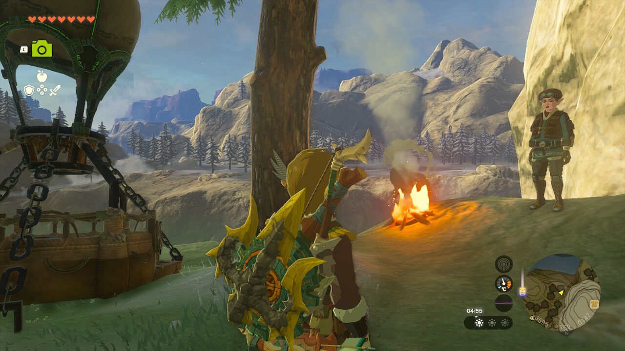 Link spricht mit einem Mann neben einem Lagerfeuer, nahe dem Dorf Rito in Zelda: Tears of the Kingdom