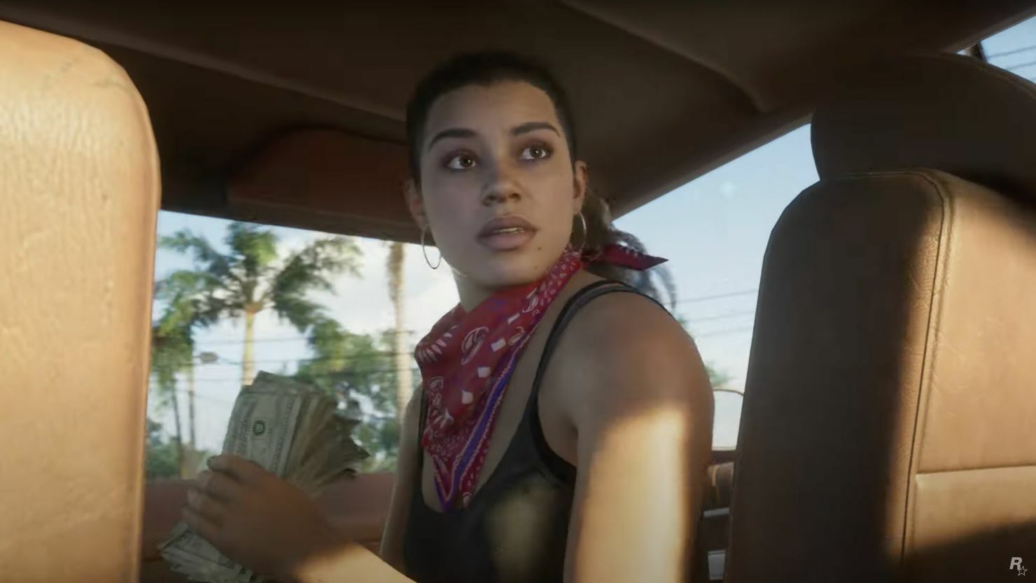 Lucia in GTA 6 sitting in a car's passenger seat and turning around to look out of the back window