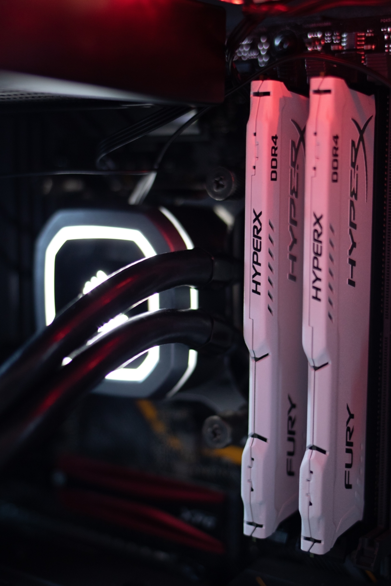 two HyperX DDR4 ram sticks plugged in a motherboard