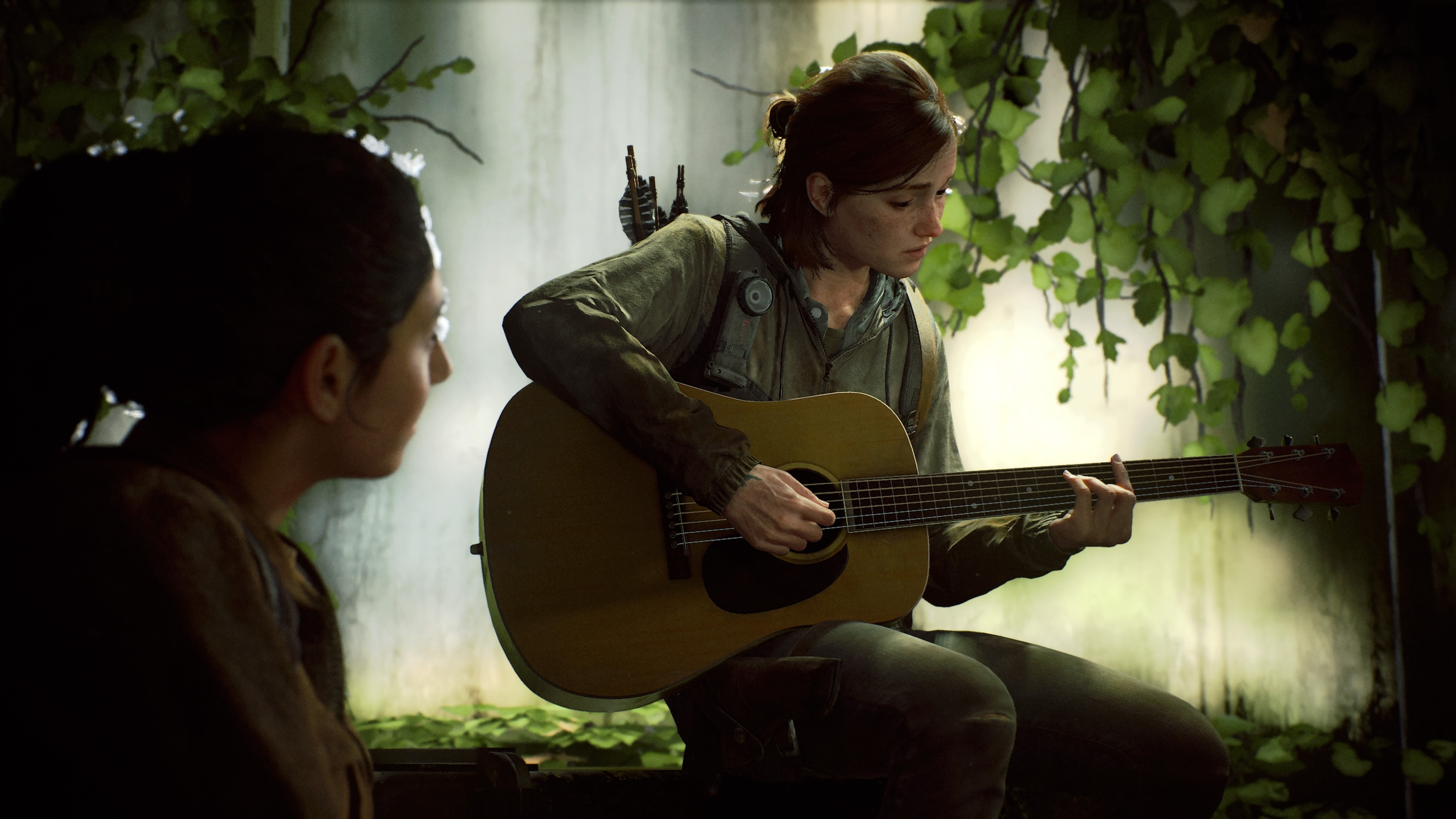 Ellie playing guitar in The Last of Us 2